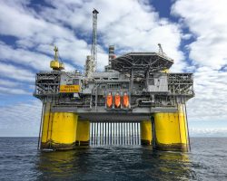 pexels-photo-3207531-3207531 Majestic offshore oil platform in Norway's North Sea, under blue skies.